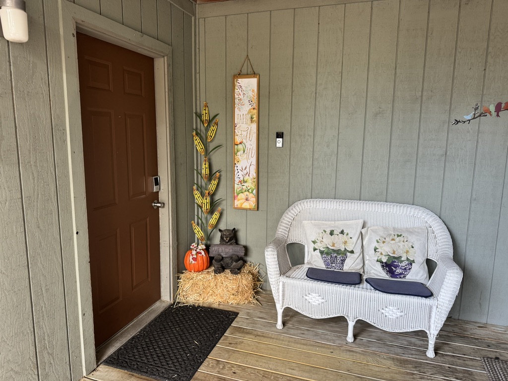 Rustic porch dressed for fall